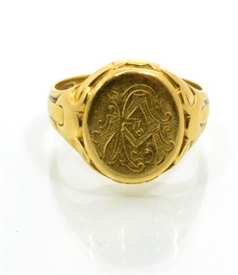 Lot 246 - An 18 carat gold signet ring, an oval plaque with engraved monogram, to fancy tapering...