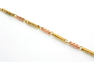 Lot 247 - A two colour bracelet, converted from an albert, of alternating rose and yellow metal fancy...