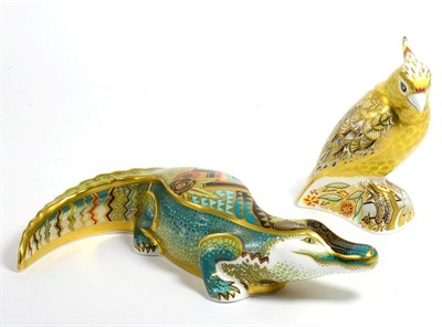 Lot 255 - A Royal Crown Derby alligator and citron cockatoo (boxed)
