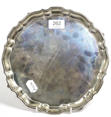 Lot 262 - A Scottish silver salver, Lawson & Co, Glasgow 1915, shaped circular on four scroll feet,...