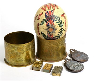 Lot 289 - Souvenir ostrich egg from the Boer War period, two trench art First World War shells, two match box