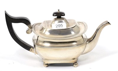 Lot 295 - A silver teapot of George III style, maker indistinct, Birmingham 1915, with egg and dart border on