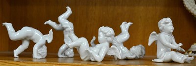 Lot 301 - A set of five Capodimonte tumbling cherubs