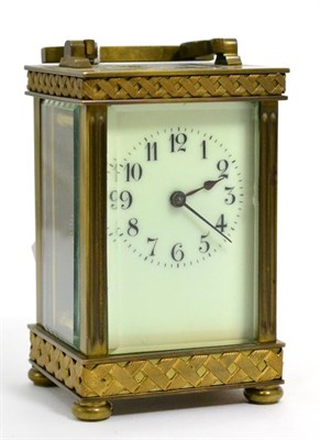 Lot 305 - A brass carriage timepiece with basket weave borders