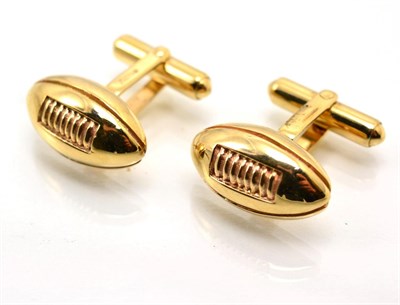 Lot 352 - A pair of 9 carat gold novelty rugby cufflinks, with rugby ball heads, to swivel bars