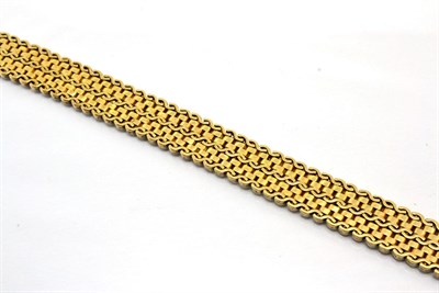 Lot 366 - A fancy link bracelet, of alternating rows of bright polished S-links and textured brick links,...