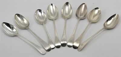 Lot 367 - A group of seven George III silver Old English pattern table spoons, various dates and makers,...