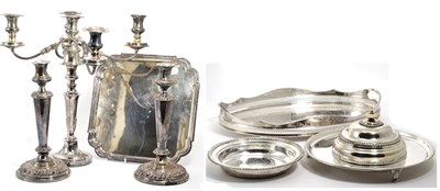 Lot 378 - A quantity of silver plate comprising a pair of Old Sheffield plate candlesticks; a five light...