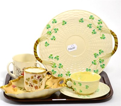 Lot 389 - A Belleek teacup and saucer and a twin handled plate, Royal Worcester floral decorated Blush...