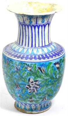 Lot 402 - An Iznik vase, probably 18th century, of baluster form, turquoise ground, foliate scroll...