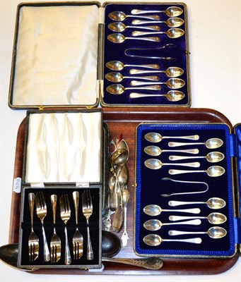 Lot 437 - A set of twelve silver teaspoons and tongs, cased; three other cases of plated cutlery; and...