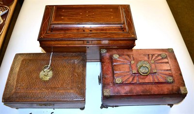 Lot 445 - A 19th century inlaid tea caddy; and two tooled leather sewing caskets (3)