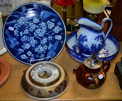 Lot 450 - A group of Doulton including a barometer, teapot, charger, wash jug and bowl (5)