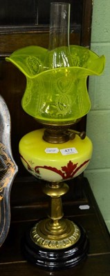 Lot 477 - A Victorian oil lamp with yellow reservoir and shade