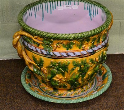 Lot 486 - A large 19th Century Majolica jardiniere and stand, unmarked, after a Minton design, decorated with