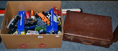 Lot 1044 - A box and a suitcase of vehicles including Lledo, Matchbox and Corgi