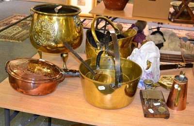 Lot 1073 - A collection of 19th/20th century copper and brasswares including coal helmet, trivets, bed warmer