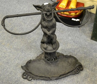 Lot 1086 - A Coalbrookdale style iron stick stand in the form of a chihuahua and riding crop