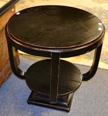 Lot 1092 - An Art Deco ebonised centre table, circular form with undertier, square plinth base, 72cm in...