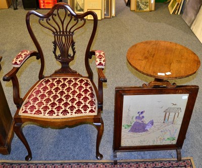 Lot 1097 - An armchair, a tripod table and a fire screen