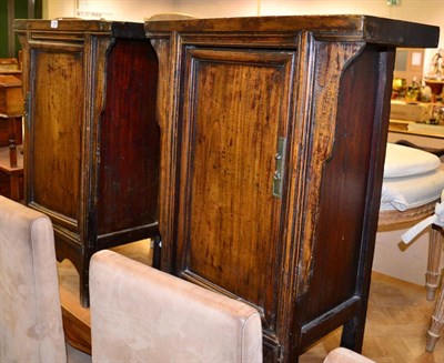 Lot 1104 - A pair of Chinese provincial bedside cabinets, single panelled doors, 85cm high (2)