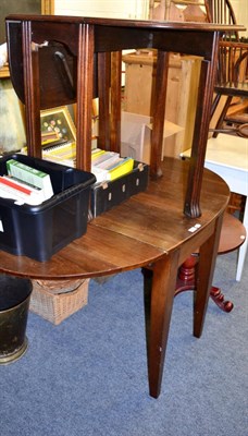 Lot 1120 - An oak dropleaf dining table, raised on fluted legs, 75cm wide; and a 19th century mahogany...