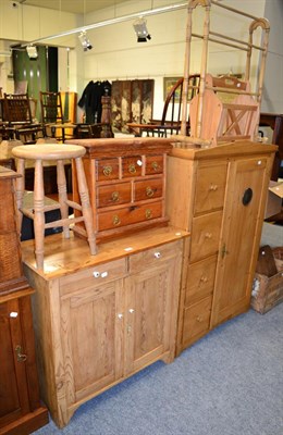 Lot 1126 - A group of pine furniture including a pantry cupboard, kitchen cabinet, stool, towel rail, magazine