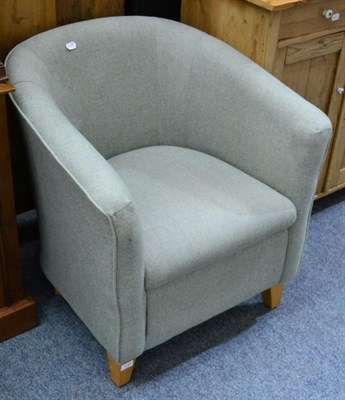 Lot 1138 - A modern green upholstered tub chair