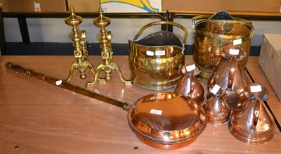 Lot 1140 - A group of copper and brass including jugs, coal buckets, andirons etc