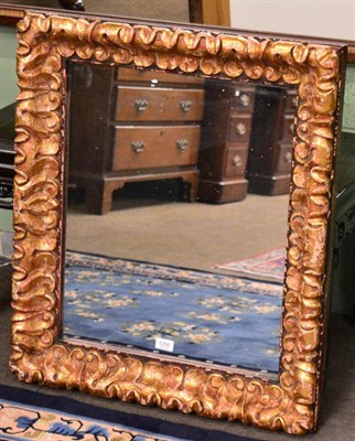 Lot 1250 - A gilt & gesso framed wall mirror, rectangular form