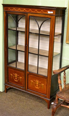 Lot 1252 - An Edwardian inlaid and painted mahogany display cabinet