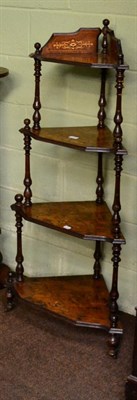 Lot 1255 - A Victorian inlaid walnut four tier corner whatnot