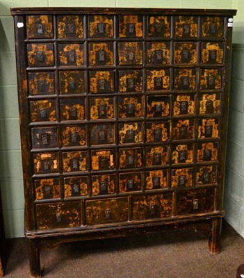 Lot 1257 - A Chinese black lacquered apothecary cabinet, 19th century, with bank of fifty three drawers,...