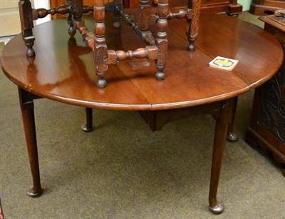 Lot 1265 - A 19th century mahogany drop leaf table raised upon pad feet