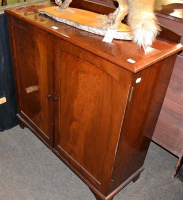 Lot 1266 - An early 20th century mahogany cabinet and a quantity of pianola music rolls