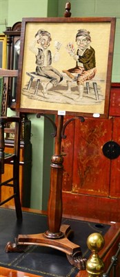 Lot 1269 - A 19th century pole screen with tri-form platform base and paw feet and inset woolwork panel