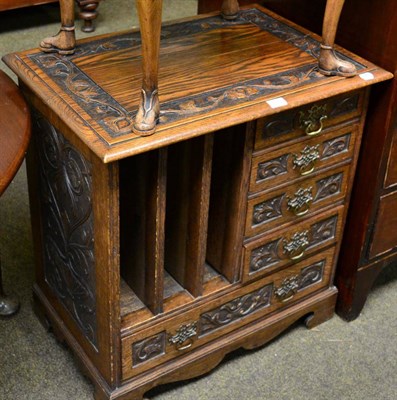 Lot 1274 - A carved oak music stand