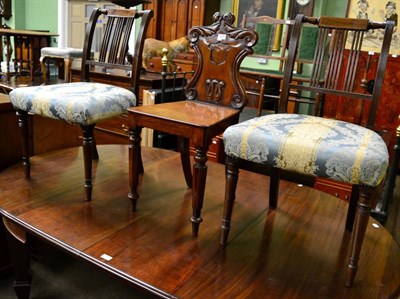 Lot 1278 - A pair of Regency mahogany chairs and another 19th century hall chair with shield back and...