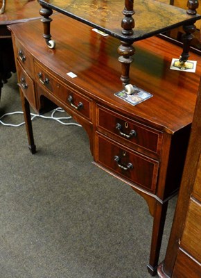 Lot 1282 - An Edwardian mahogany bow front side board