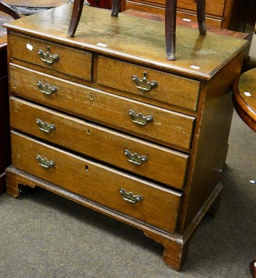 Lot 1289 - A George III oak four height chest of drawers