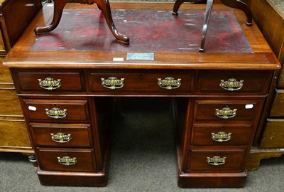 Lot 1292 - A mahogany twin pedestal desk with leather inset top afixed with a later label inscribed...