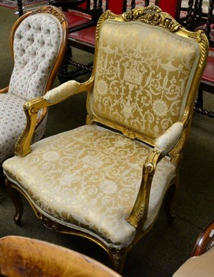 Lot 1298 - A French giltwood fauteuil in Louis XV style carved with foliate cresting, the back seat and...