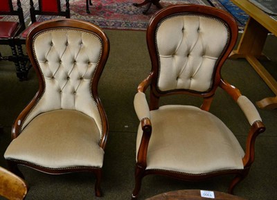 Lot 1299 - A button back open armchair, together with a matching ladies chair