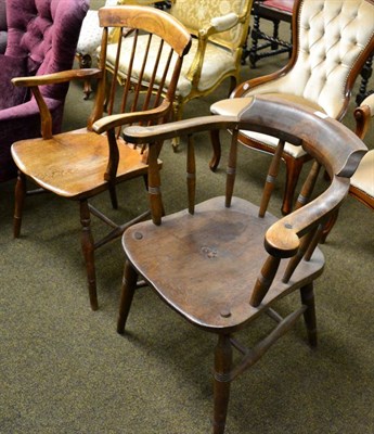 Lot 1300 - A 19th century oak captain's chair together with an oak stick back chair (2)