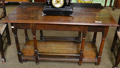 Lot 1311 - An oak low dresser, 18th century and later, together with an oak gateleg drop leaf table