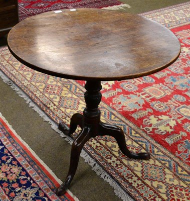 Lot 1320 - A George III mahogany tripod table, on cabriole supports