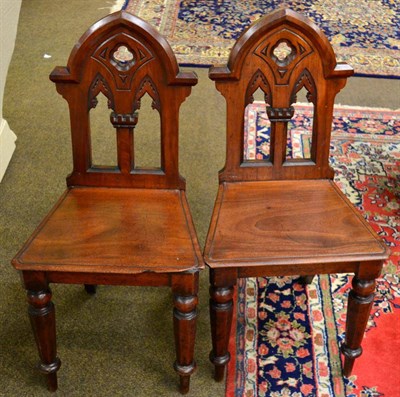 Lot 1321 - A pair of Victorian mahogany hall chairs