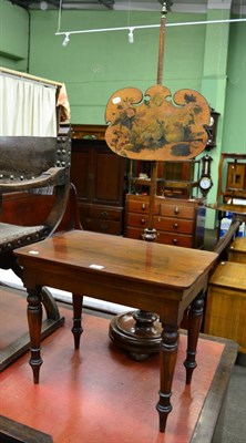 Lot 1327 - A 19th century mahogany pole screen together with a low table of similar date (2)