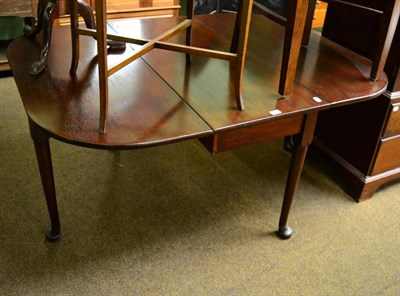 Lot 1333 - A 19th century mahogany gate leg dining table on pad feet