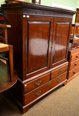 Lot 1334 - A mahogany linen press of small proportions